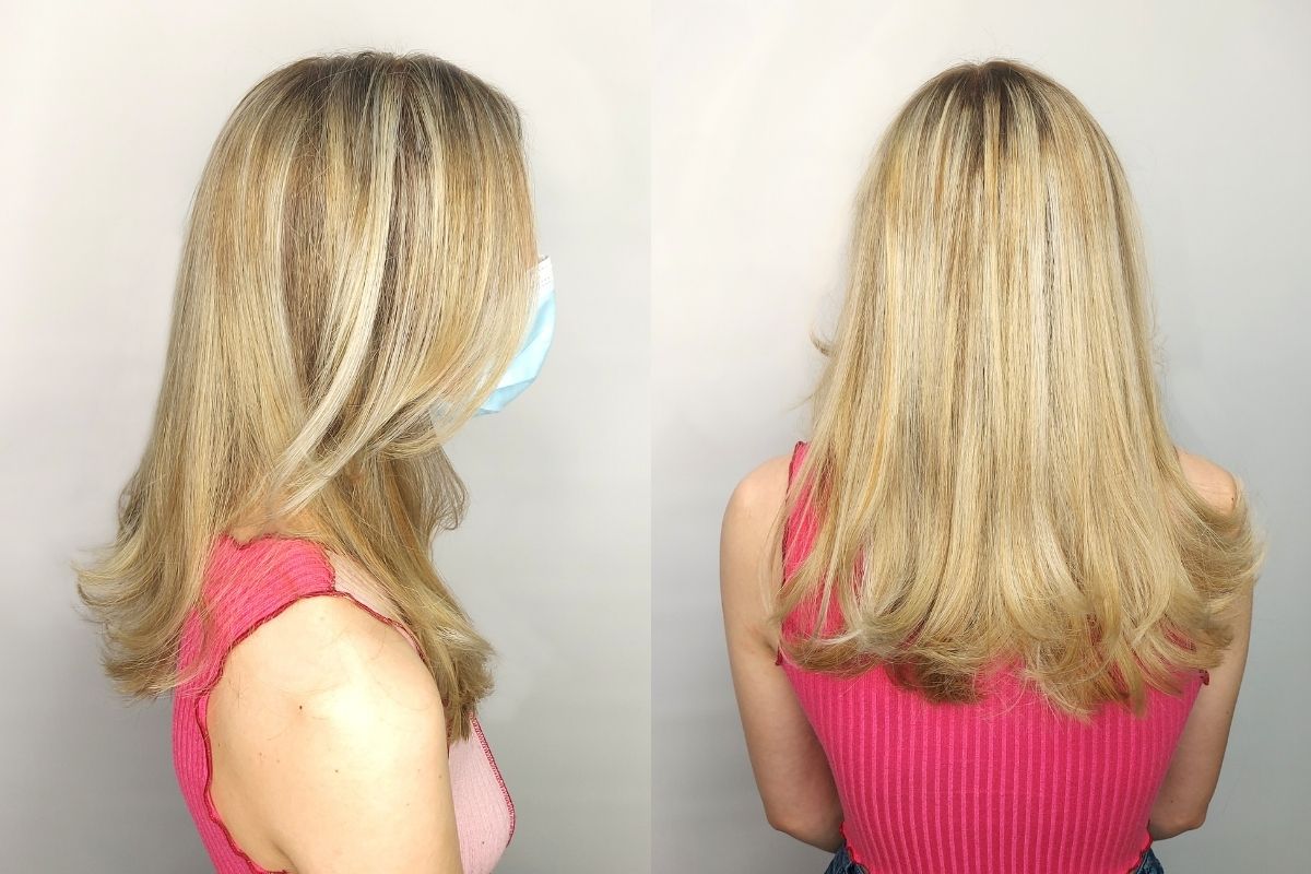 long blonde highlights hair with mask on, side profile